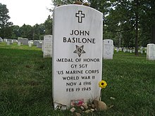 https://upload.wikimedia.org/wikipedia/commons/thumb/c/c0/John_Basilone_headstone_Arlington_National_Cemetery_section_12_site_384.JPG/220px-John_Basilone_headstone_Arlington_National_Cemetery_section_12_site_384.JPG