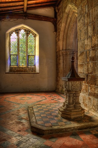 The 13th Century font in the west end of the south aisle