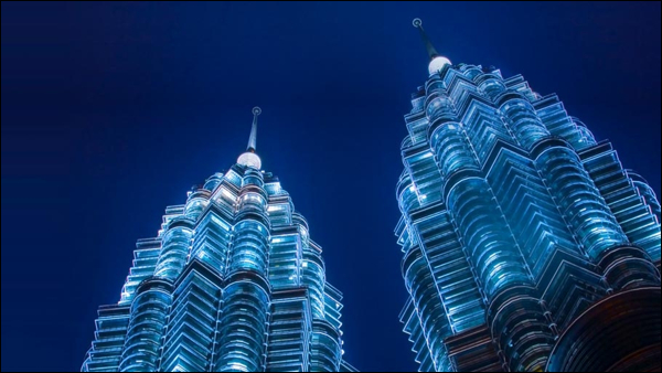 The Petronas Twin Towers serve as a landmark.